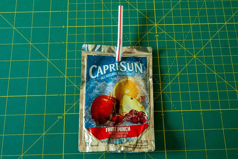 Capri sun with a large bendy straw