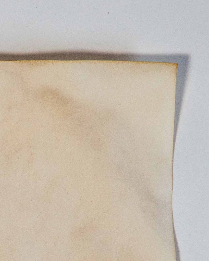 Edge of paper stained in black tea