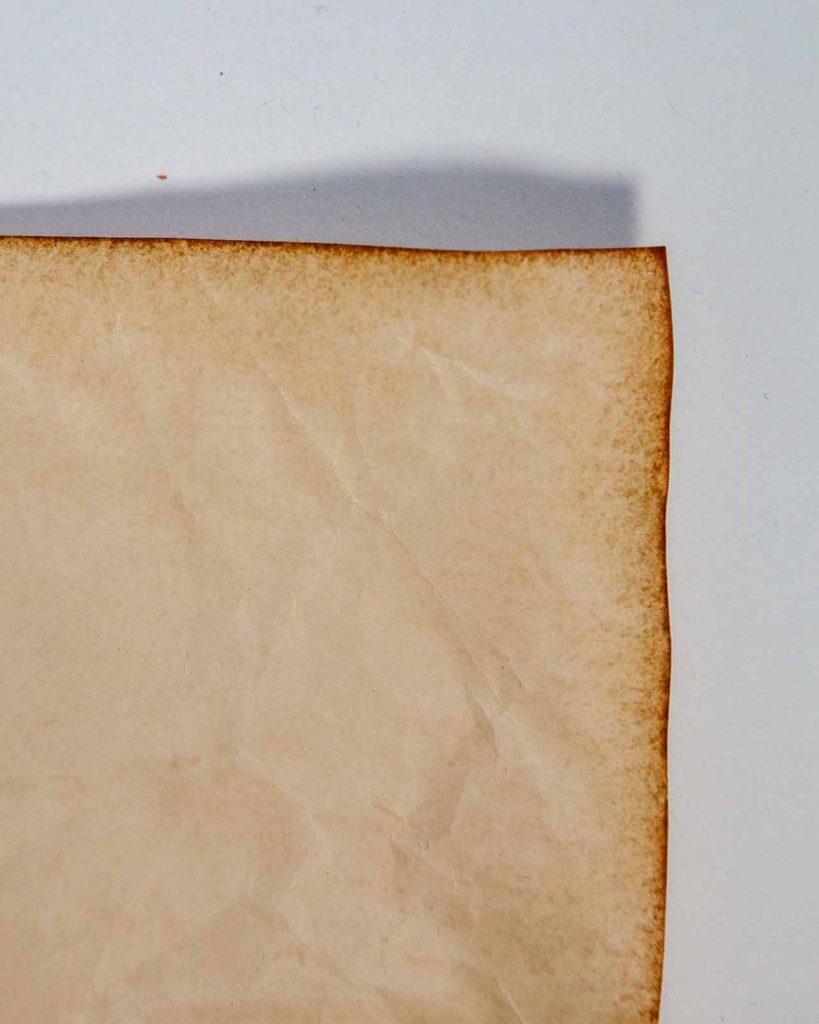 Edge of paper stained in coffee