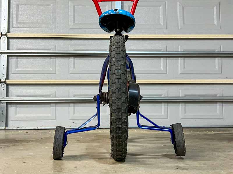 image of a kids bike with training wheels set to the correct height
