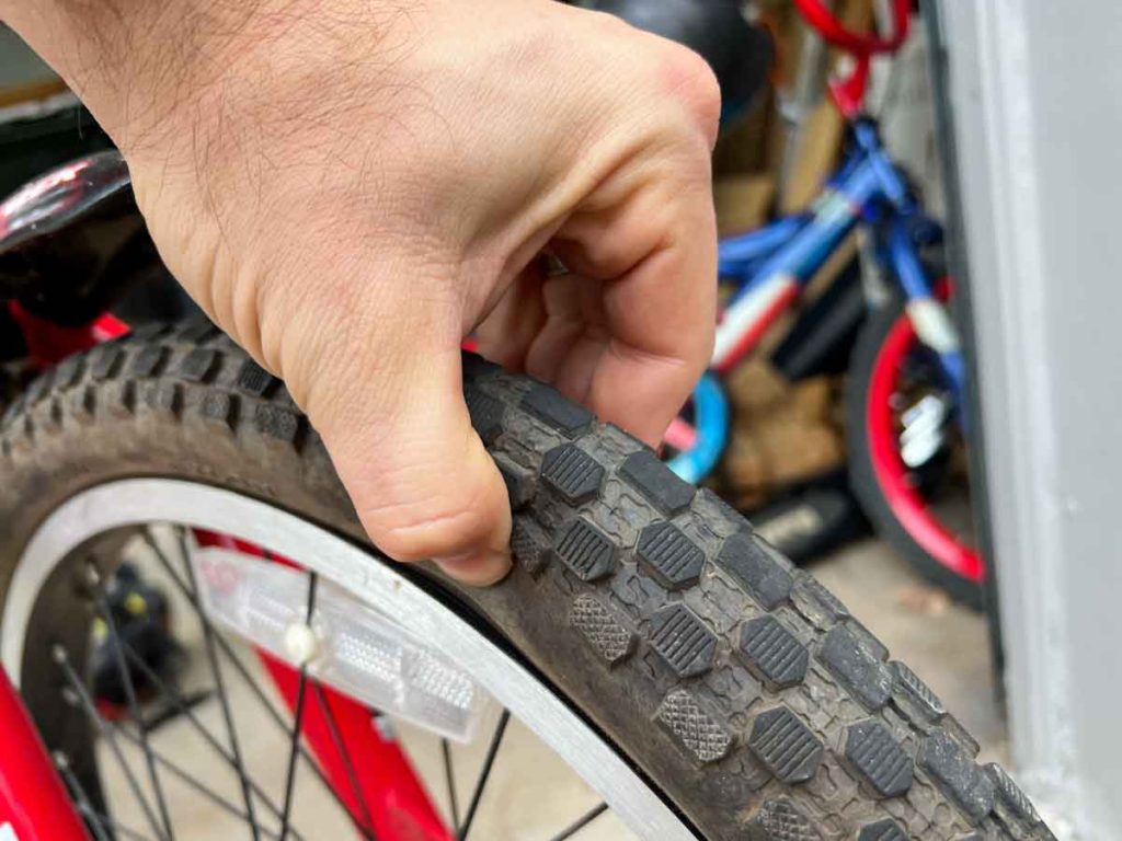 Squeezing a flat bike tire