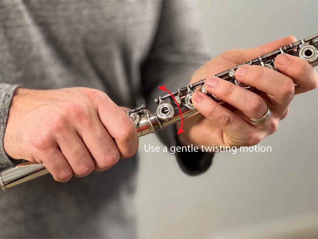 Image demonstrating a gentle twisting motion to connect the body and foot joint of the flute