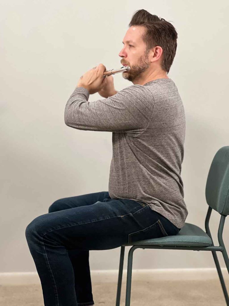 Image of good posture while playing the flute