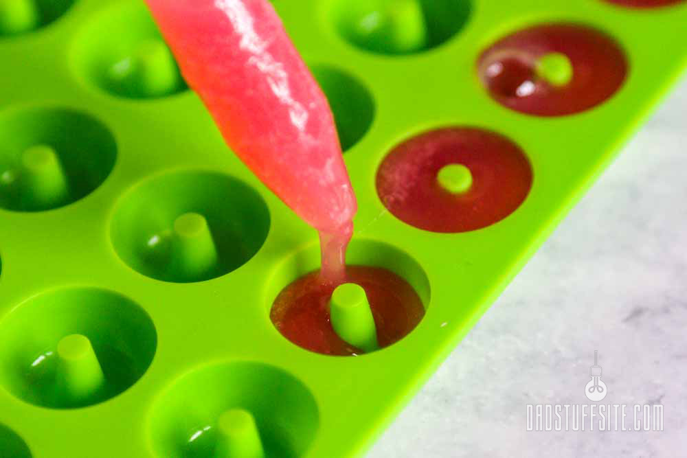 Piping gummy mixture into gummy molds